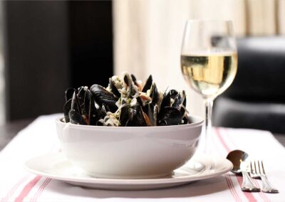 Bistro-Niko-Mussels-Gilbert with a glass of white wine