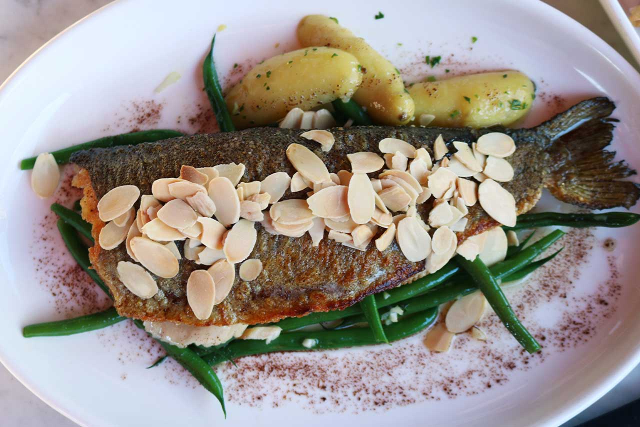 whole fish with almonds, green beans and potatoes